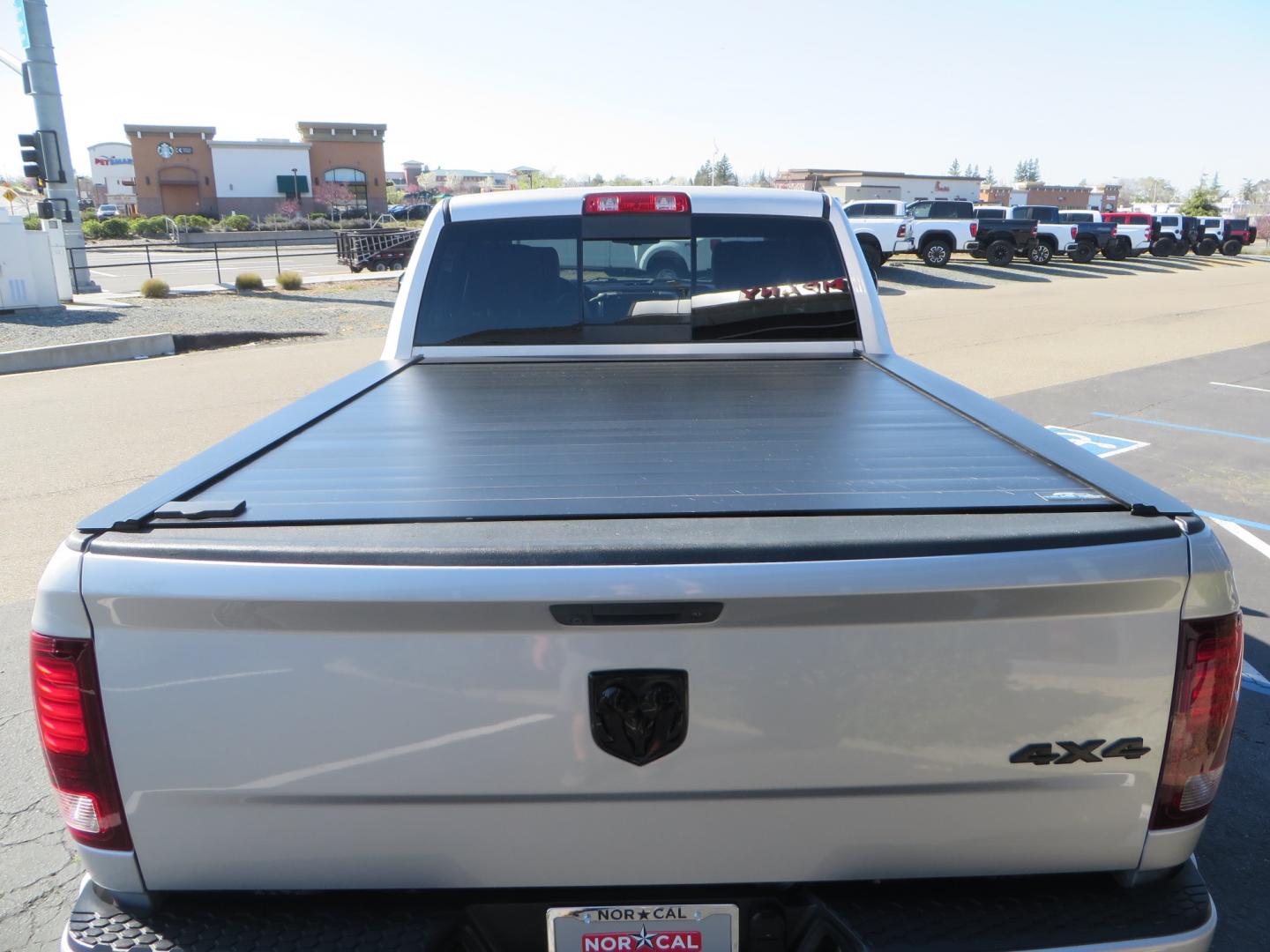 2016 SILVER /BLACK RAM 2500 Laramie Crew Cab SWB 4WD (3C6UR5FL3GG) with an 6.7L L6 OHV 24V TURBO DIESEL engine, 6A transmission, located at 2630 Grass Valley Highway, Auburn, CA, 95603, (530) 508-5100, 38.937893, -121.095482 - Leveled Ram sitting on Fuel Offroad wheels, Falken Wildpeak AT tires, Amp Power steps, Rolling Bed cover, Color matched fender flares, and window tint. - Photo#11